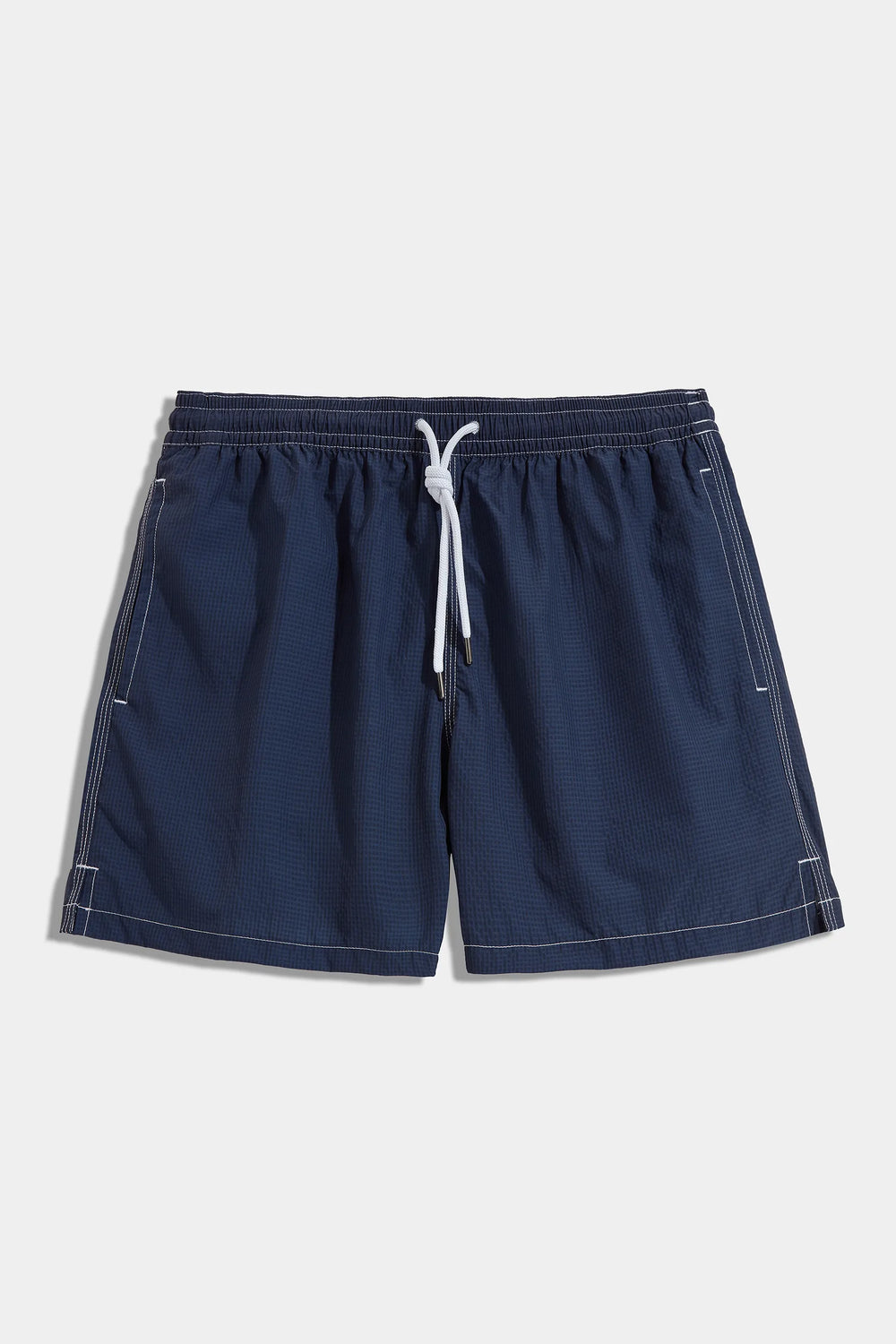 High-end navy blue seersucker swim shorts, Italian navy swimwear, luxury men’s swim shorts, premium seersucker swimming trunks, elegant summer shorts, handcrafted Italian swim shorts, stylish navy trunks, short de bain bleu marine en seersucker fabriqué en Italie, maillot de bain italien haut de gamme, short de bain de luxe pour homme, short de bain élégant en coton gaufré, costume da bagno blu navy in seersucker fatto in Italia, pantaloncini da mare eleganti italiani.